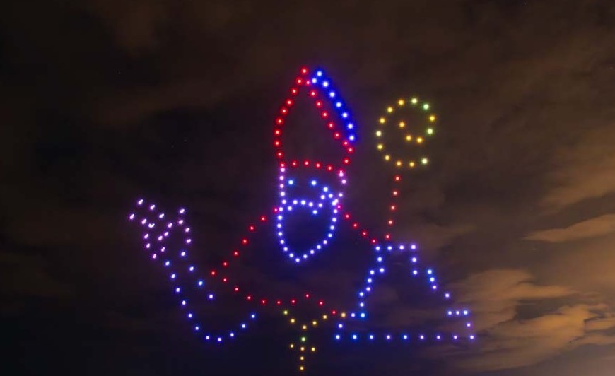 Saint Nicholas figure formed by drone lights over the coast