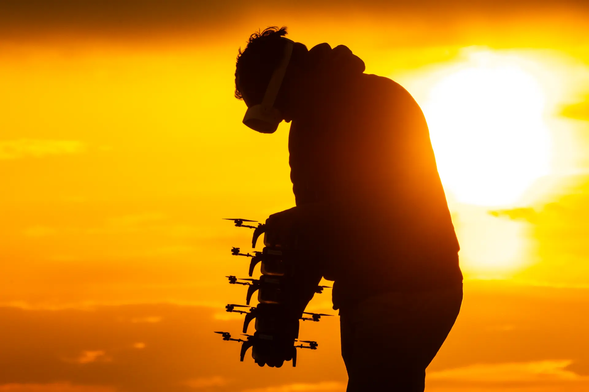 LightX pilot wearing AR goggles while placing the drone launch grid at sunset